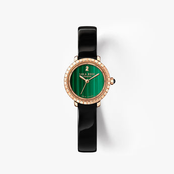 A watch with a black ceramic strap, rose gold case, and a green malachite dial, shown against a clean white background.