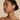 Side view of model wearing Ivy Collection stud earrings, featuring a gold-beaded ivy leaf design with mother-of-pearl and a central teardrop diamond, highlighting natural elegance.
